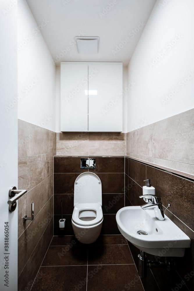 Choose a compact toilet to optimize narrow bathroom functionality