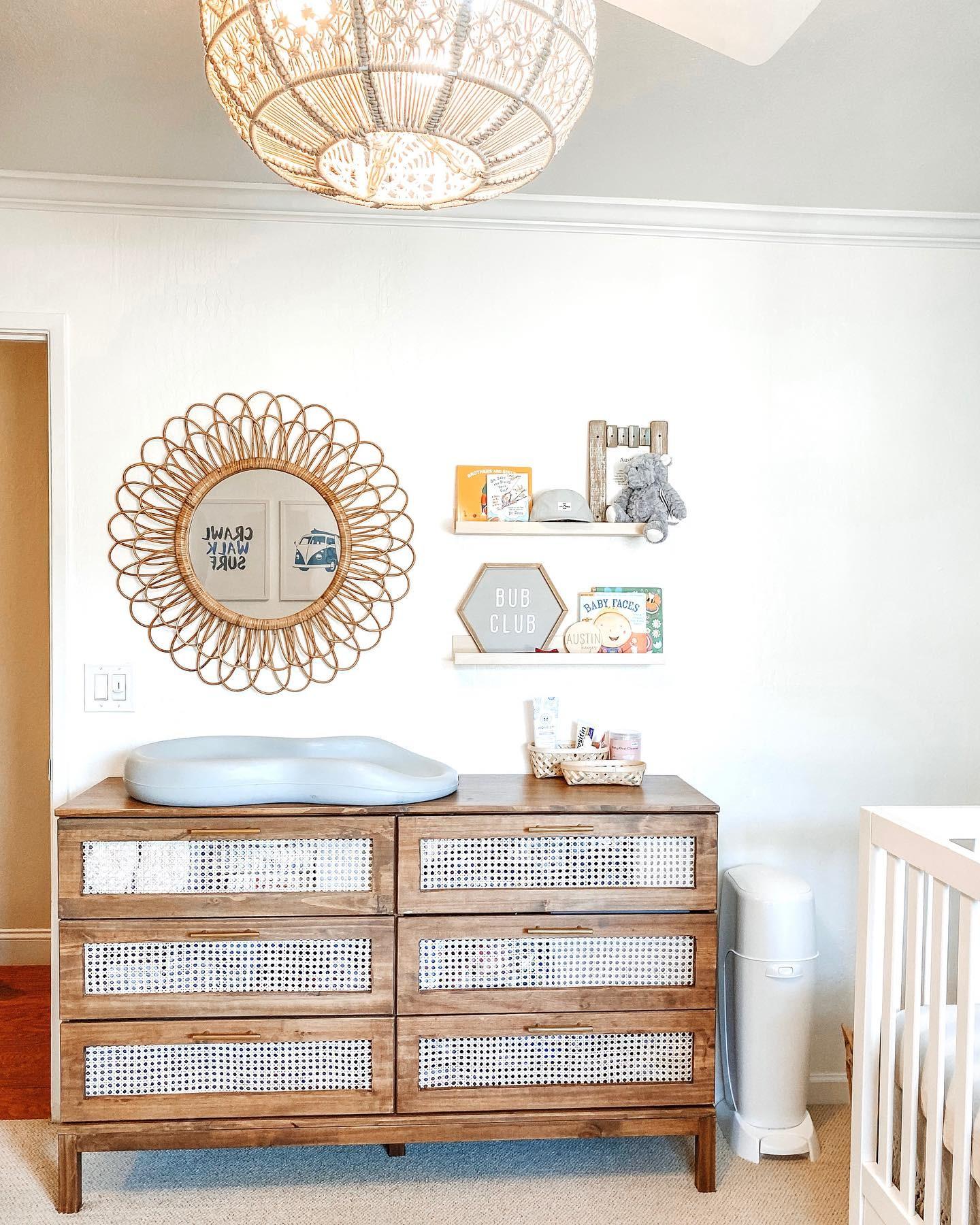 A changing table doubles ​as a stylish surface in the nursery nook