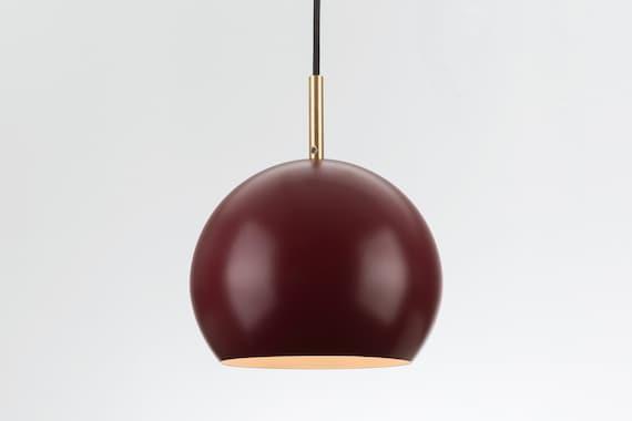 Choose decorative lighting fixtures that complement the hues of ‍your burgundy⁢ kitchen