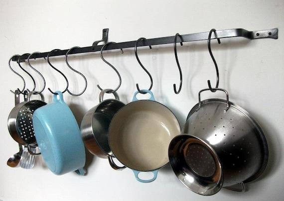 Hang ⁣pots and pans‌ on wall ​hooks in ⁣your⁣ galley kitchen