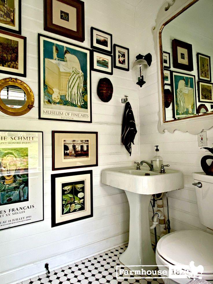 Randomly arranged artwork creating‍ a ⁣gallery wall⁤ in your eclectic bathroom