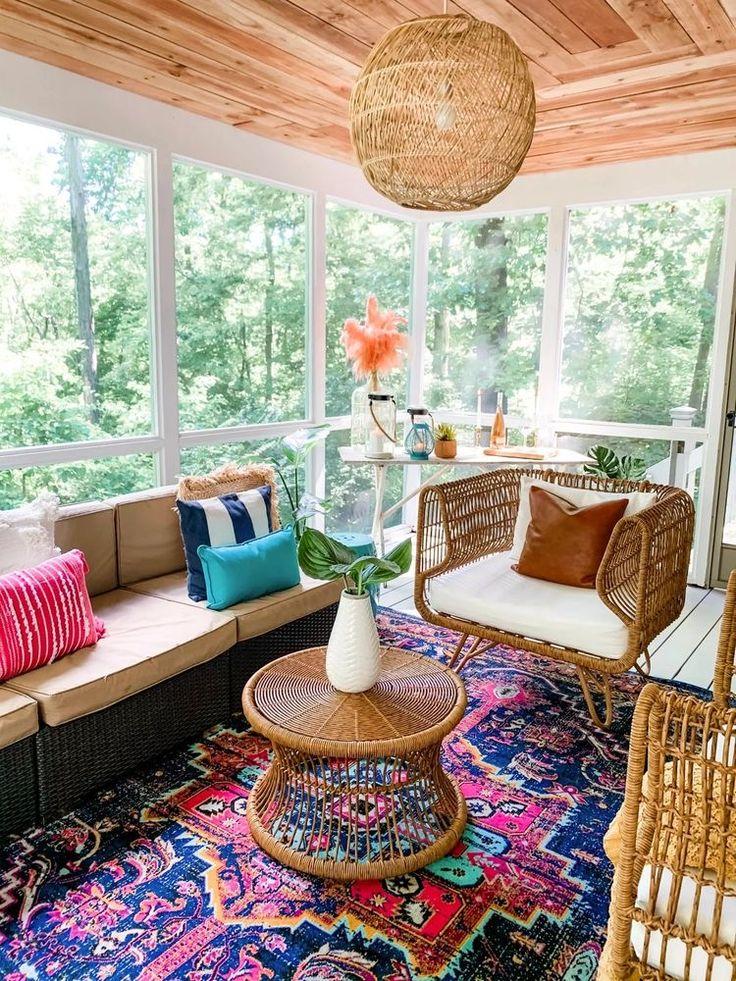 Use colorful outdoor rugs to define spaces on your screened porch