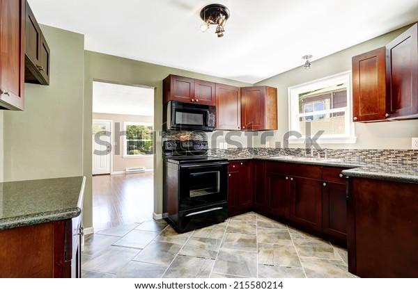 Opt for wood elements to provide warmth in your Burgundy Kitchen