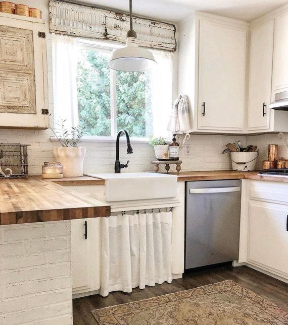 Elegant farmhouse-style curtains add softness to your‍ kitchen’s windows