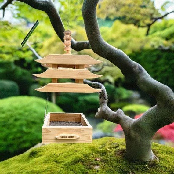 Invite birds with feeders to ⁣bring movement and sounds ‌to your Zen Garden