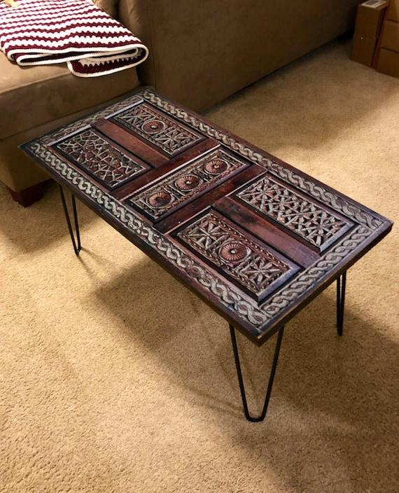 Choose a statement coffee table made from reclaimed wood for your Boho Living Room