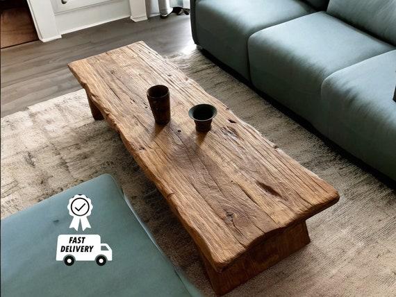 Add a live edge coffee table for a rustic touch in your Earthy Living Room