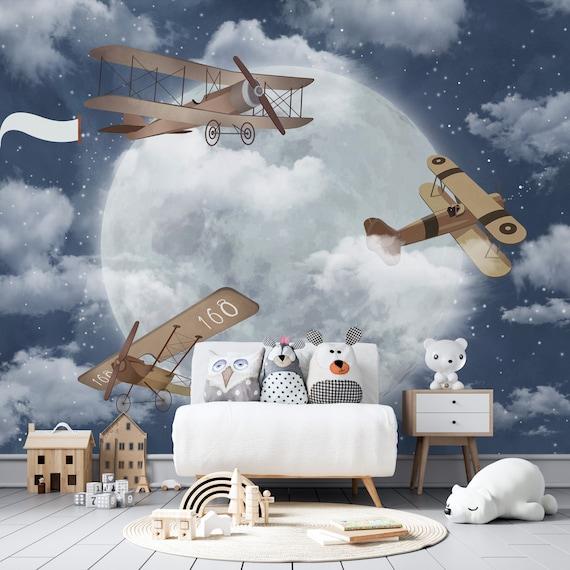 Airplane Adventures: Soar high with airplane decor and clouds on the walls of your boy nursery