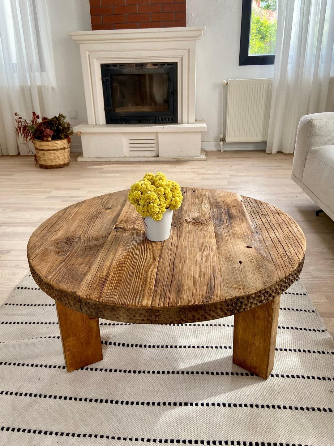 Incorporate a wooden coffee table to anchor the Earthy Living Room design