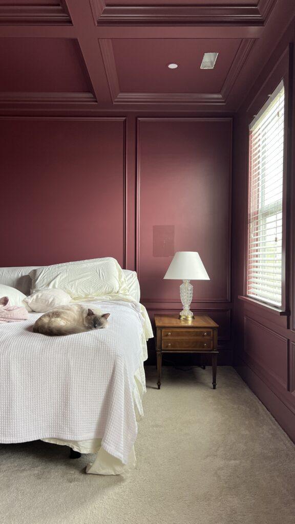 Paint one wall a lighter shade to brighten the Burgundy Bedroom