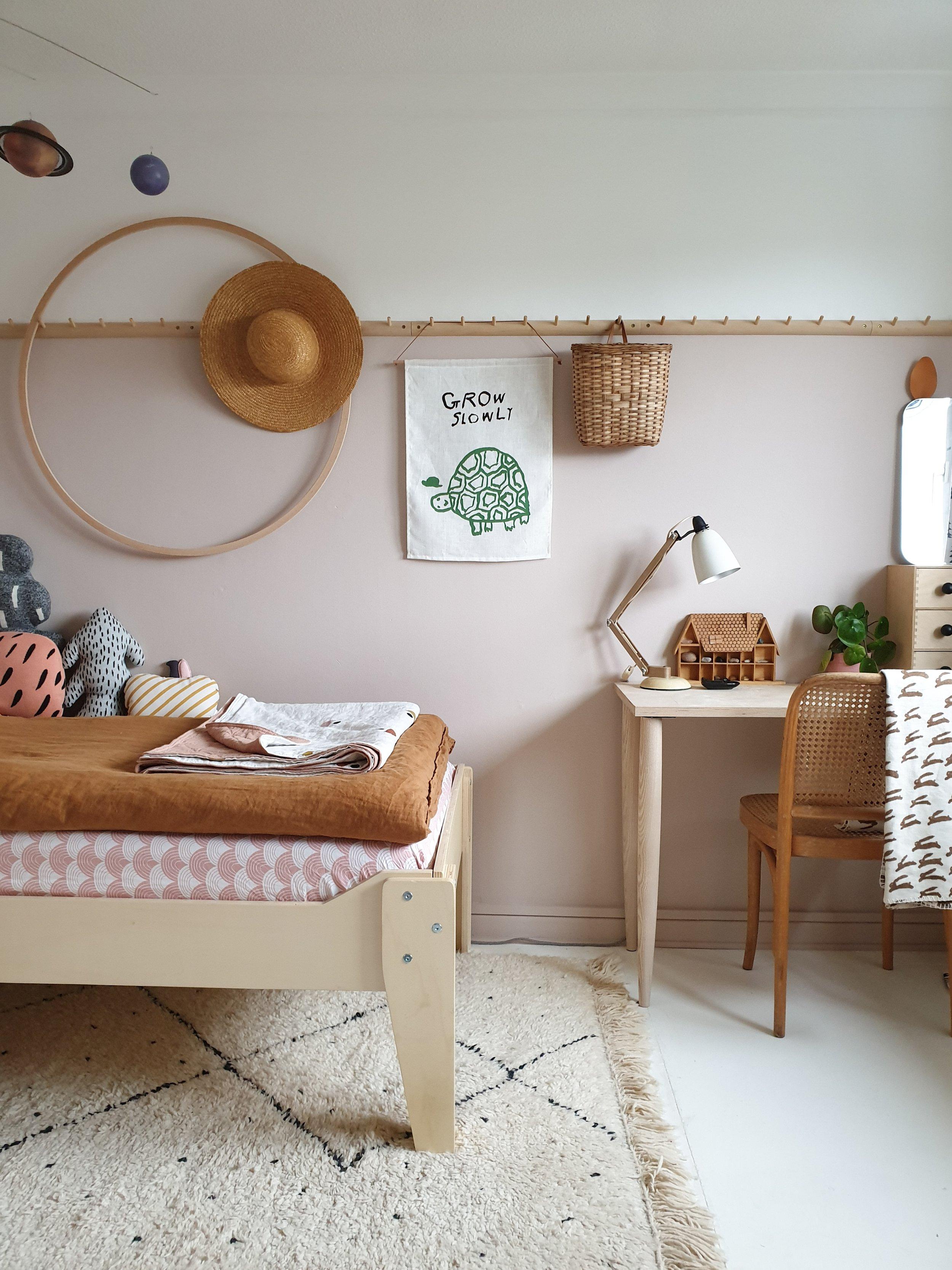 Scandinavian teen bedroom with bright whites and ​natural ‌woods for a fresh feel