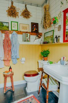 Add a funky stool for a pop of color in your eclectic bathroom