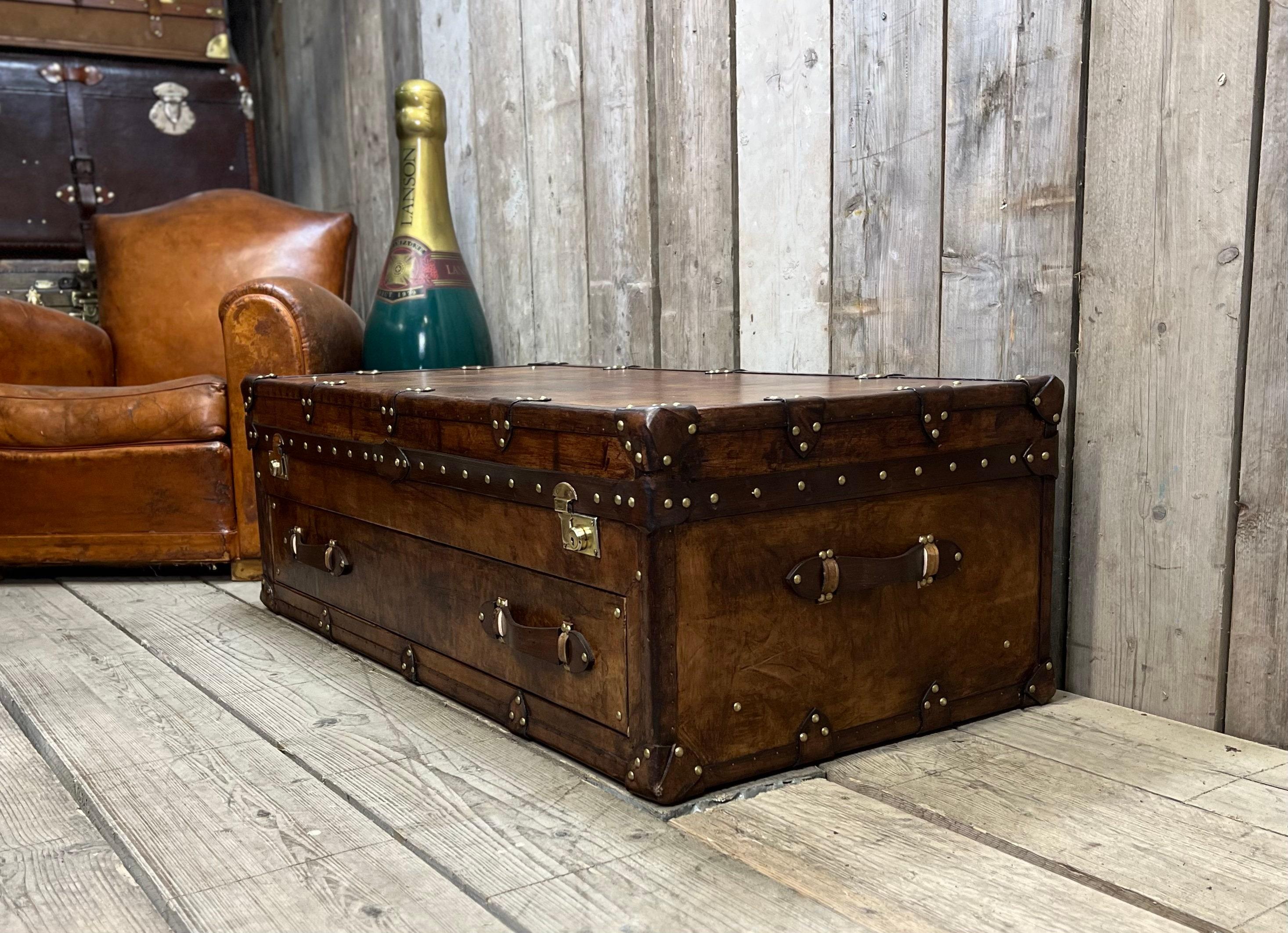 An antique trunk serves as a unique coffee table in your eclectic living room