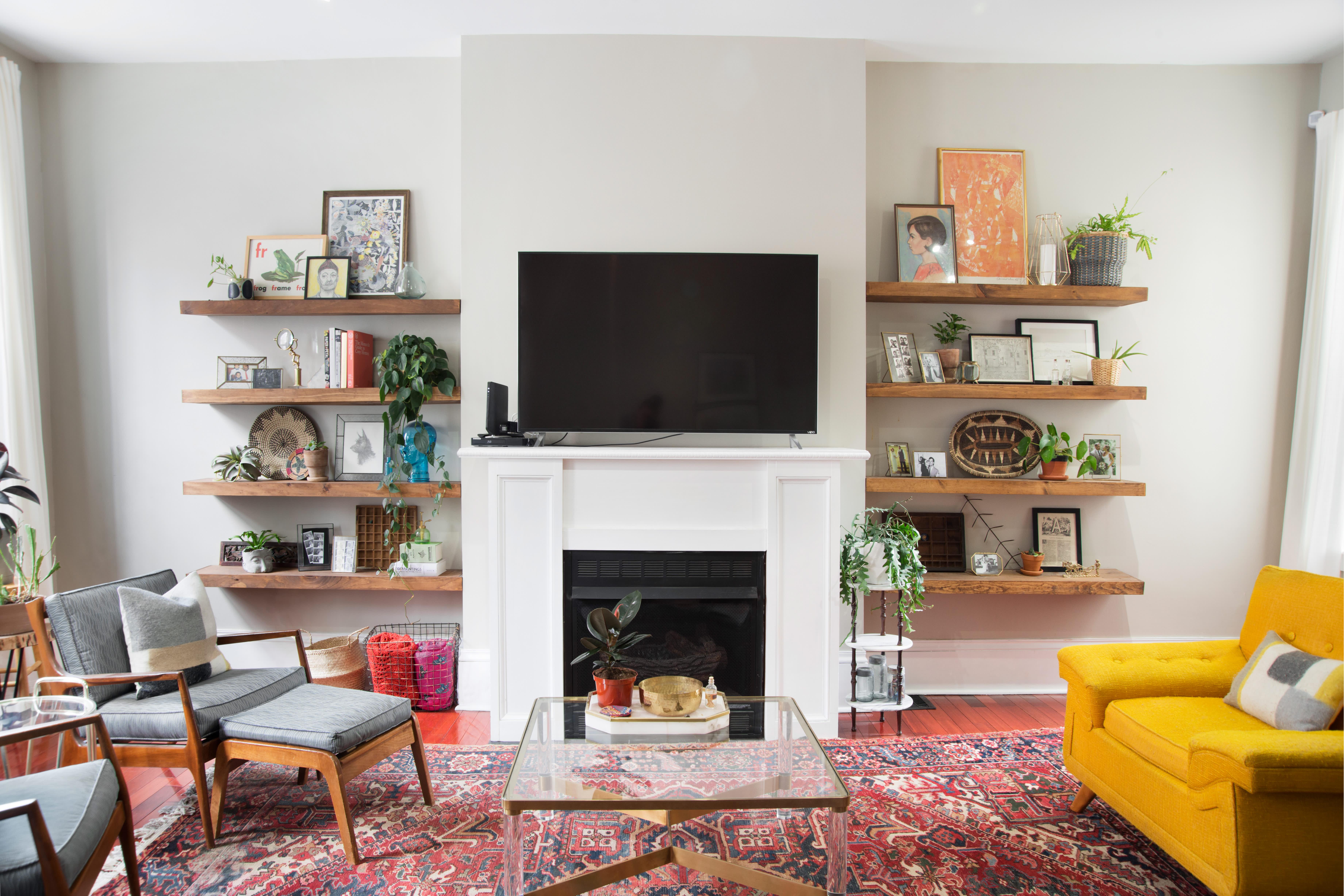 Gallery-style floating shelves display your treasures in an intriguing eclectic living room