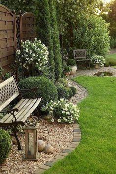 Set up a rustic bench​ amid flowering shrubs in⁣ front yard landscaping