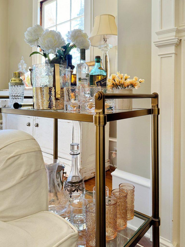 A stylish bar cart provides functionality and flair to your eclectic living room