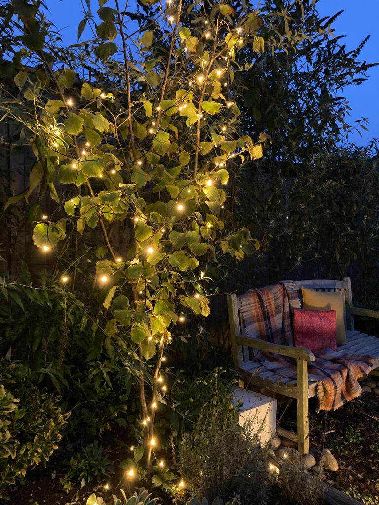 Integrate​ a pallet ‌garden with fairy​ lights‌ for enchanting evening ambiance