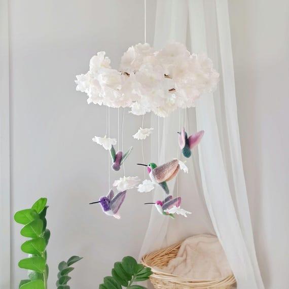 Hang a whimsical mobile above the crib in the boy nursery