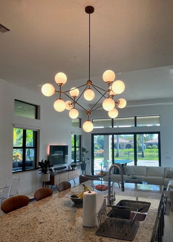 Incorporate a statement chandelier to elevate your modern living rooms elegance