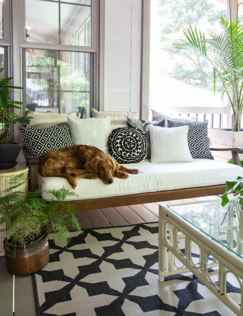 A cozy reading nook to unwind with a book in your screened porch