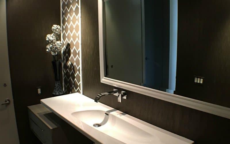 Incorporate mirrored surfaces to create an illusion of space in small bathrooms