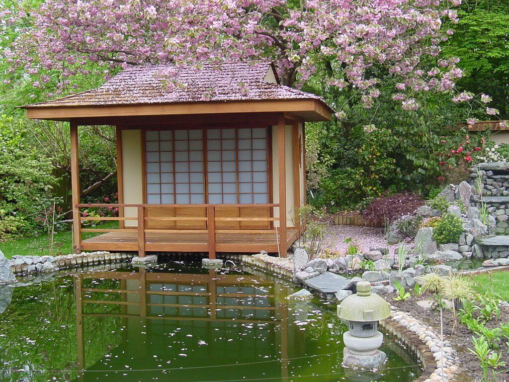 Incorporate traditional elements like a tea house to enhance your Zen Garden’s authenticity