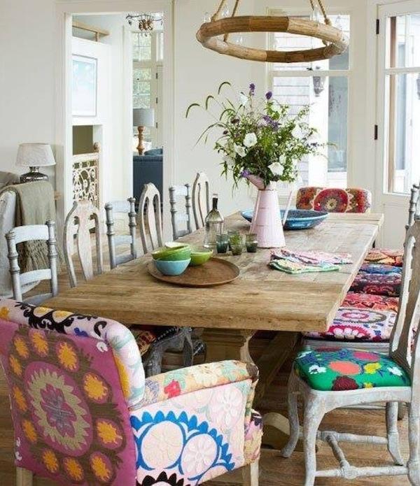 Mismatched dining chairs create a playful vibe in your eclectic living room