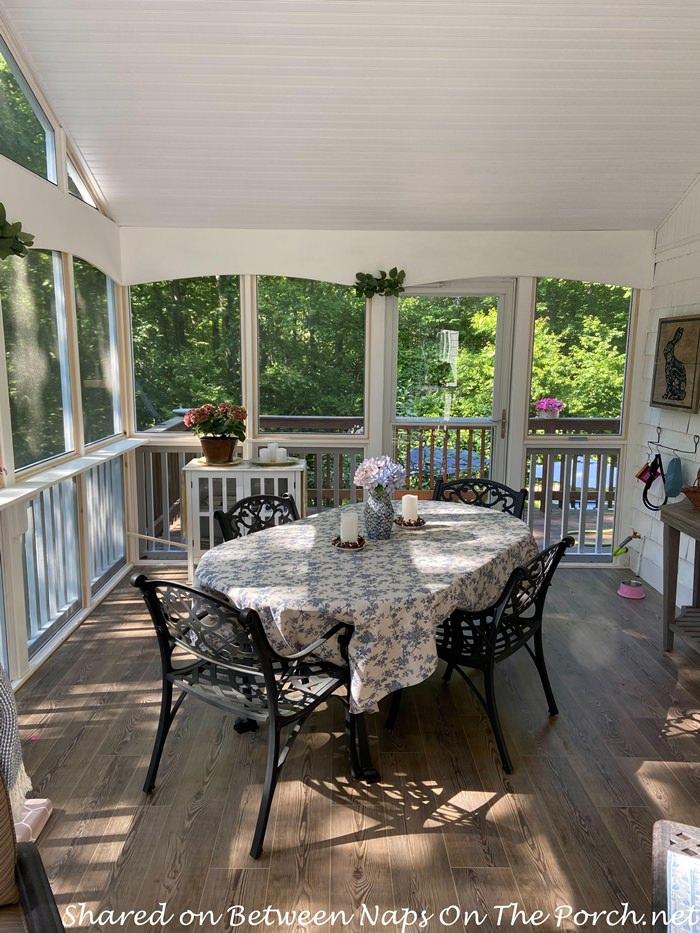 Create a dining space for al fresco meals on your ​screened porch