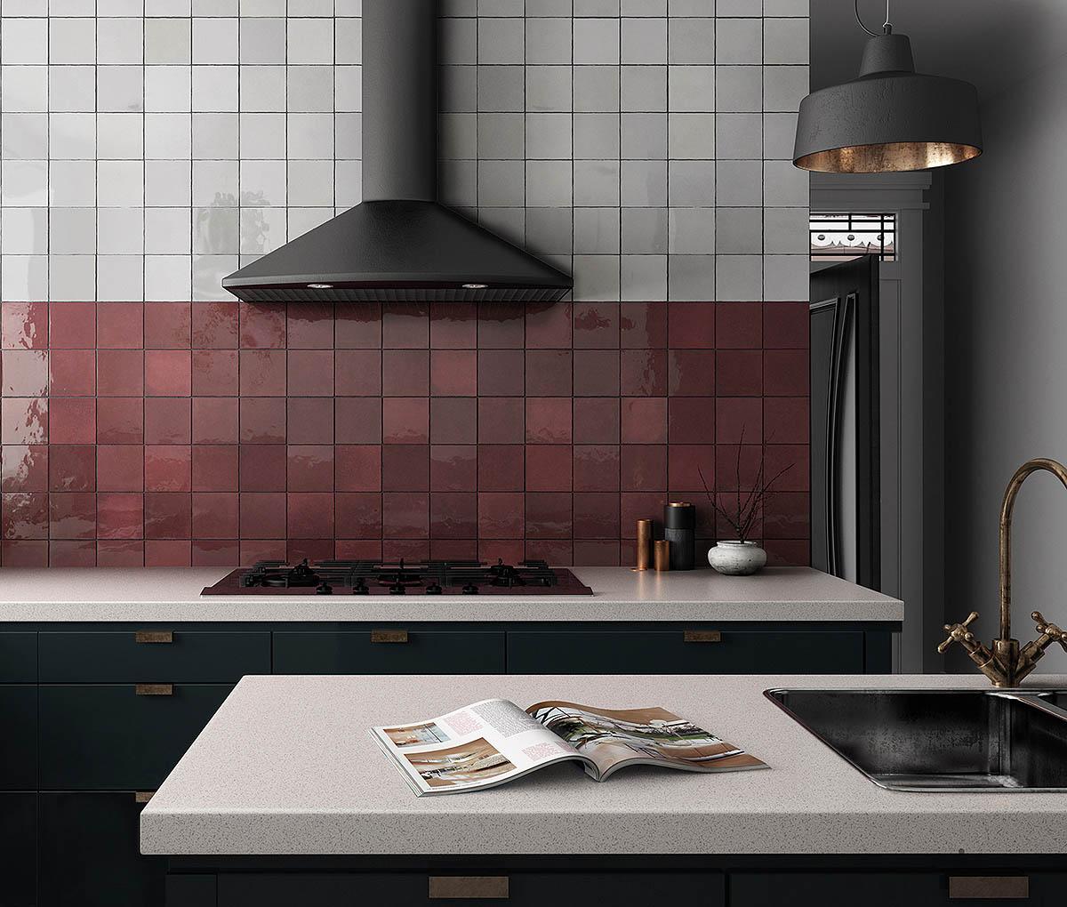 Mixing textures, like gloss and matte, creates visual interest in​ a burgundy kitchen