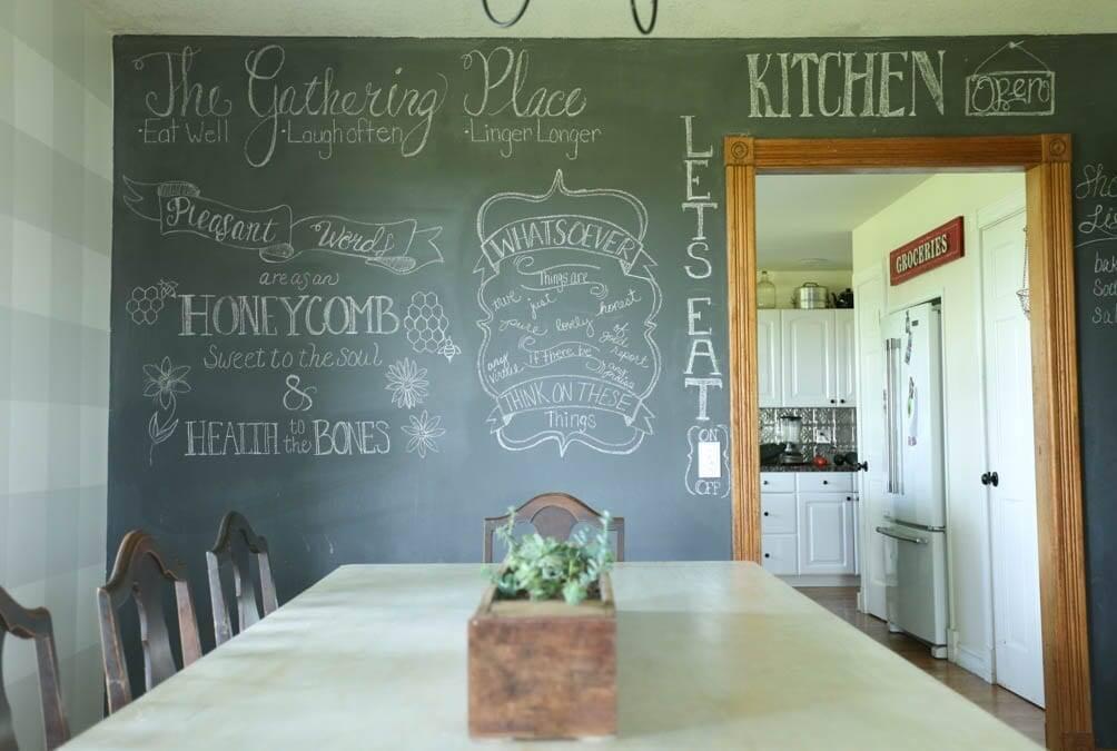 A chalkboard wall invites creativity into your farmhouse kitchen space