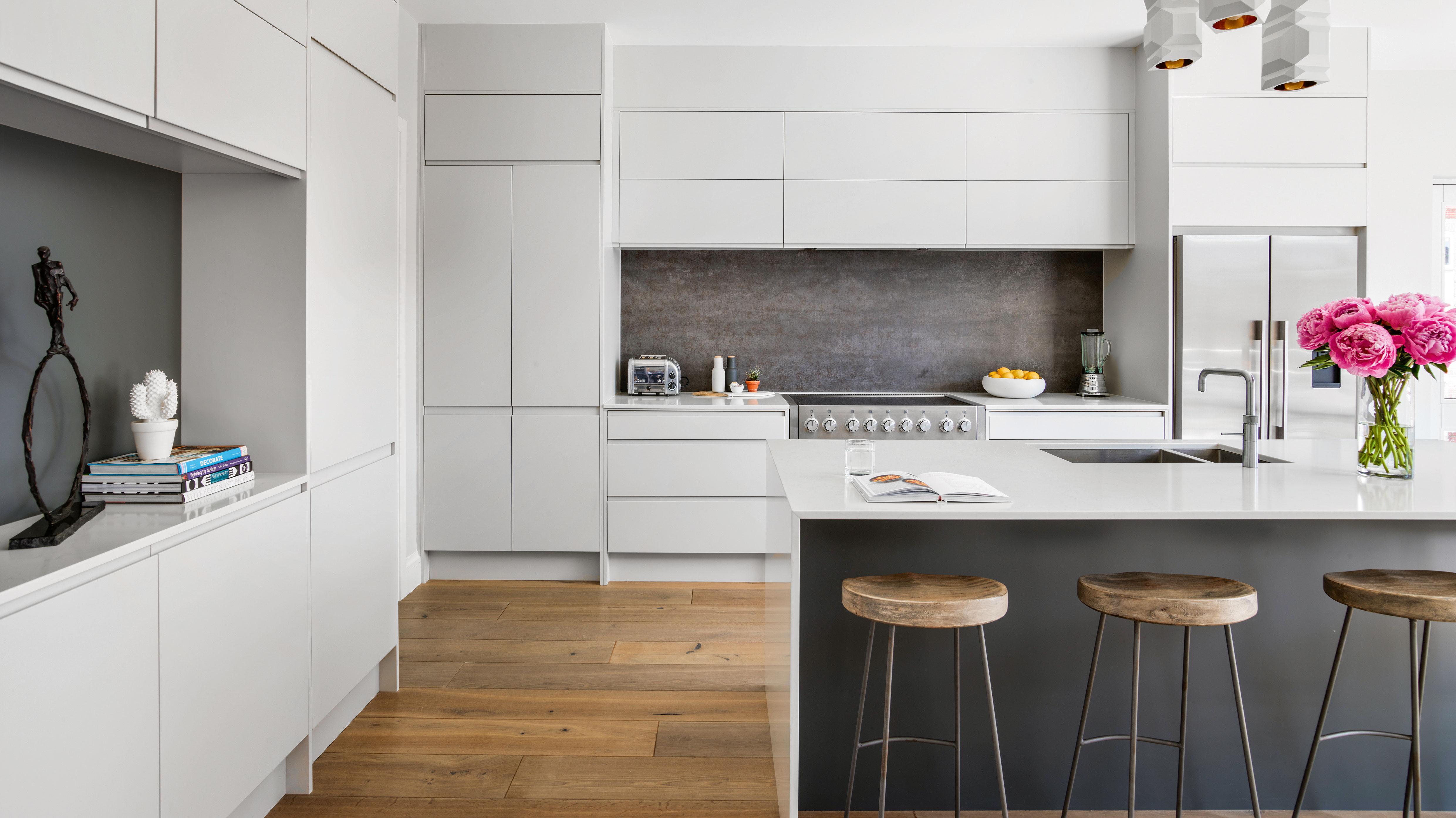 Minimalist kitchen designs emphasize clean lines and simplicity