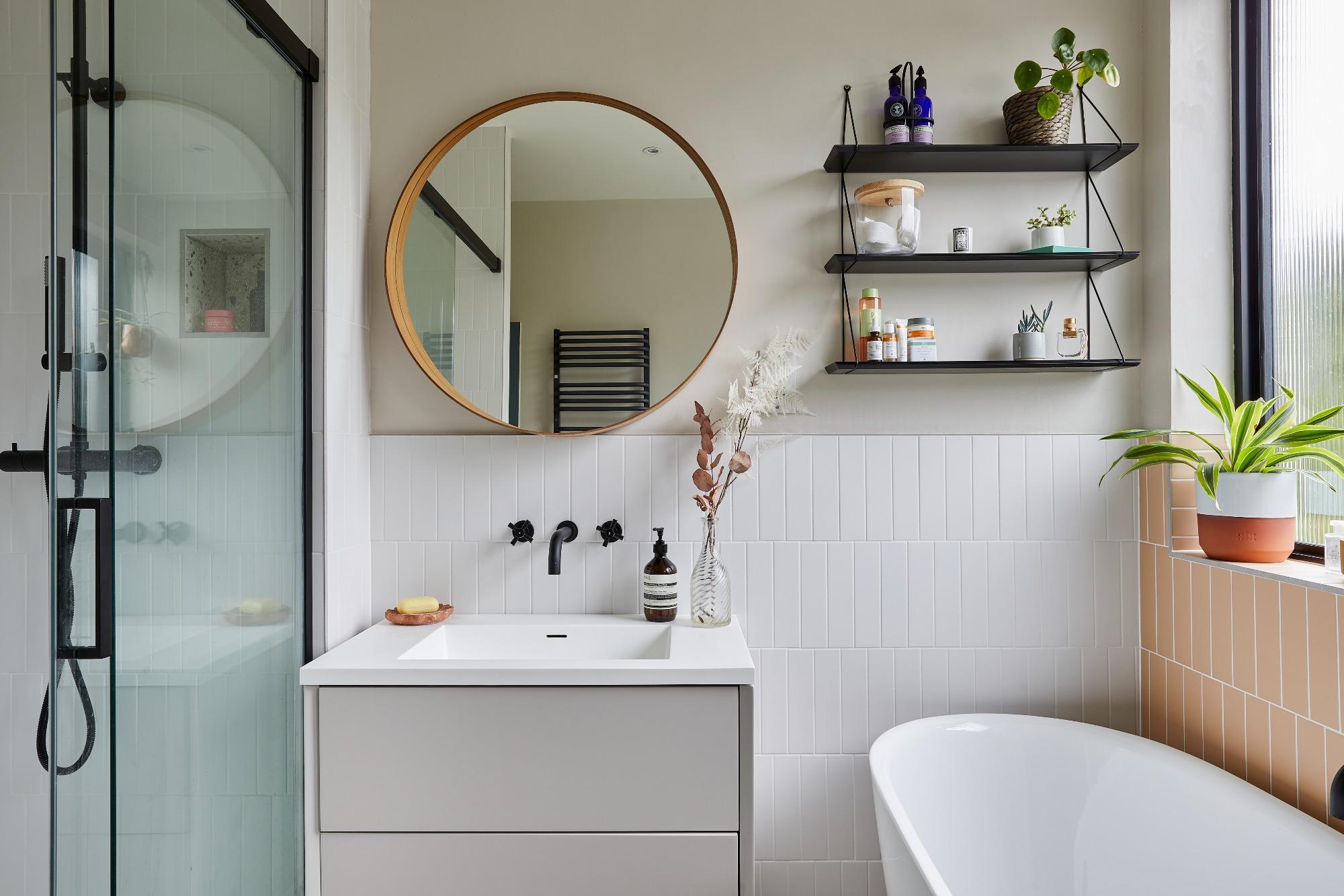 Hang mirrors strategically to create depth in narrow bathroom areas