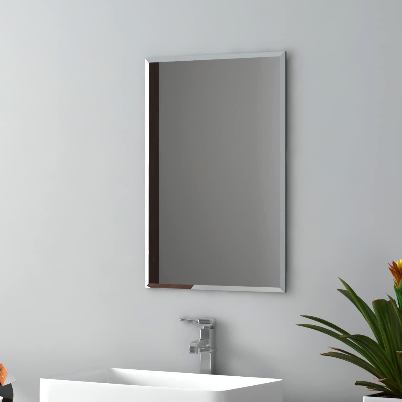 Hang⁣ a wall-mounted mirror to reflect light in your small bathroom