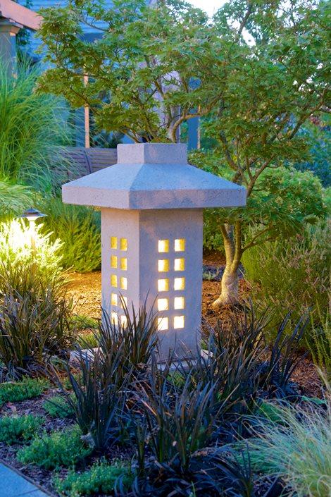 Create a focal point with a stunning sculpture in your front yard landscaping