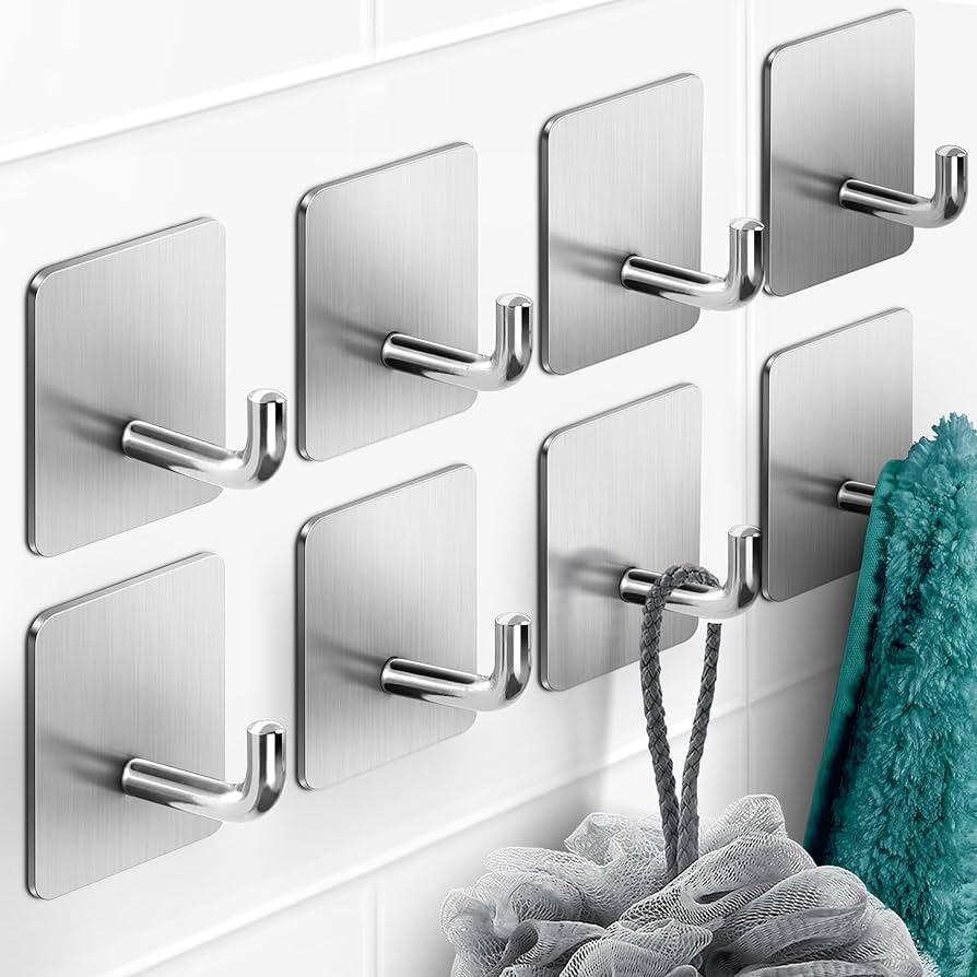 Use adhesive hooks to hang items off the floor in ⁤small bathrooms