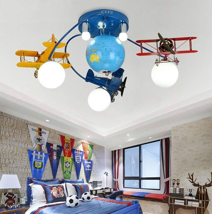 A unique light fixture can be​ a statement piece ​in​ a⁣ boy nursery