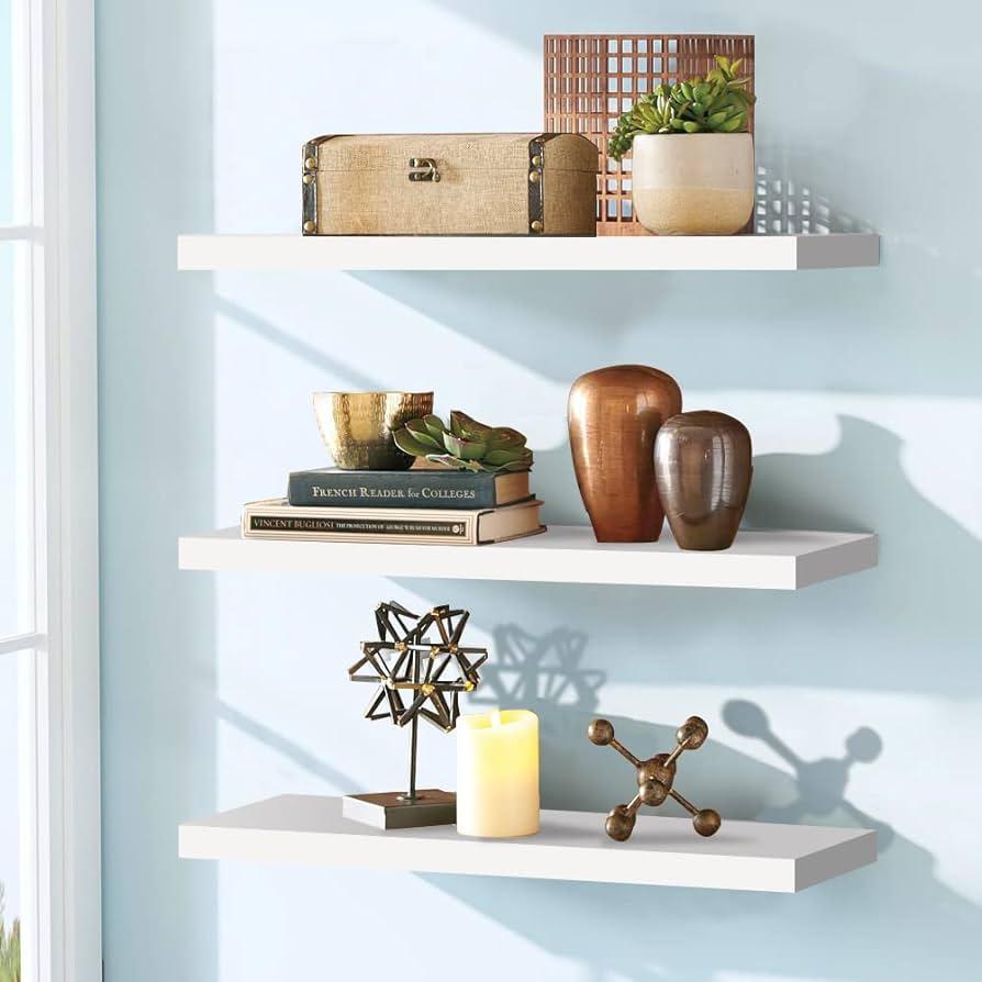 Floating ⁤shelves ⁣displaying curated ‍decor in your eclectic​ bathroom