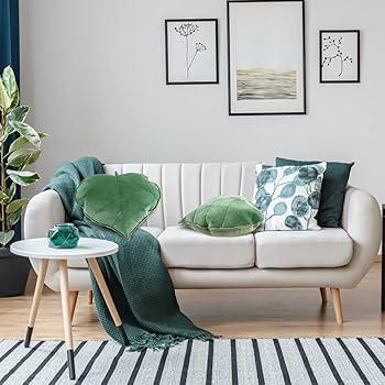 Layer different⁤ shades of green⁣ in pillows and ‌plants for your ​earthy living room