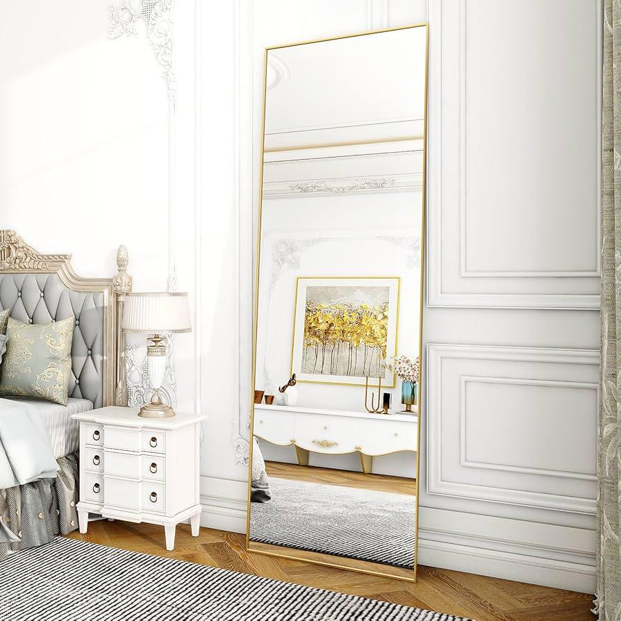 Use a simple, sleek mirror ​to enhance light in your minimalist bedroom