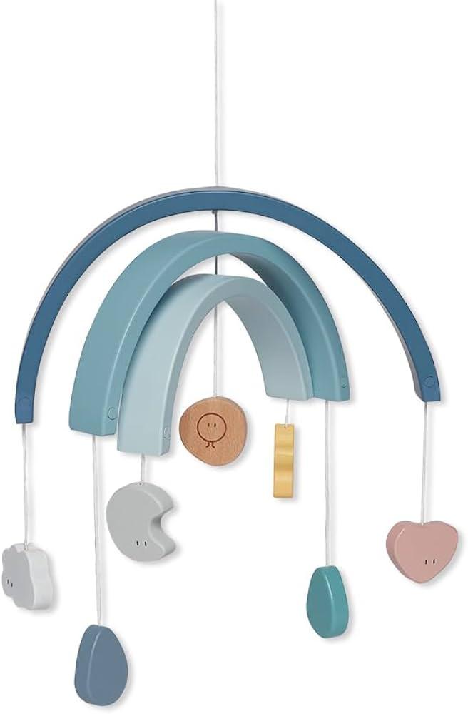 A whimsical mobile hanging over ‍the crib in your Nursery Nook