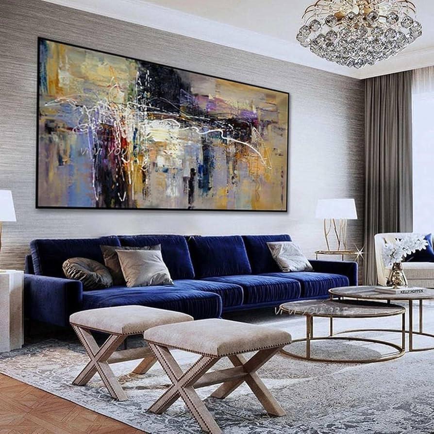 Hang oversized art pieces to enhance ‌your living room’s ‌aesthetic