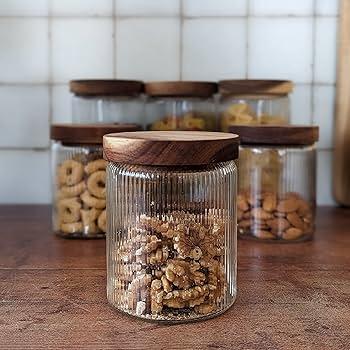 Recycled glass jars‌ for eco-friendly storage in farmhouse bathrooms