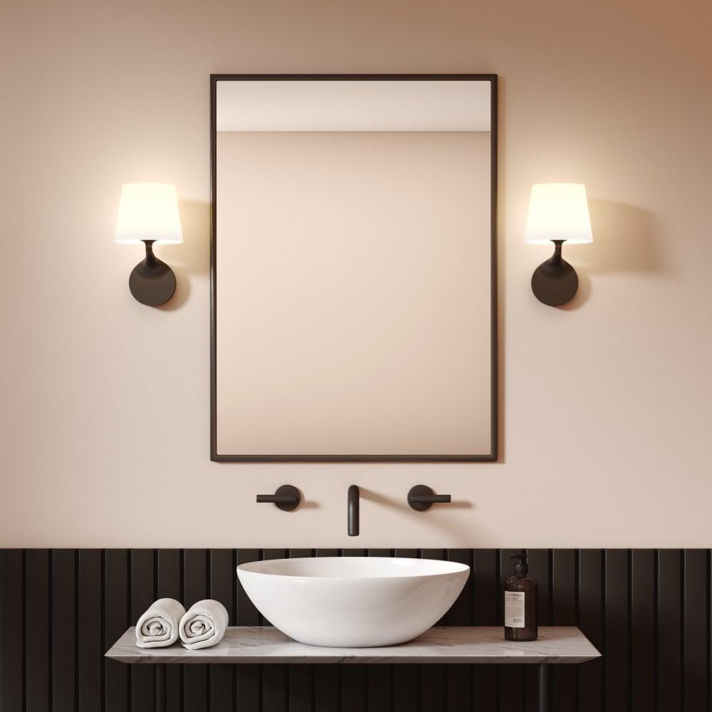 Install wall-mounted lighting to free up space in your small bathroom