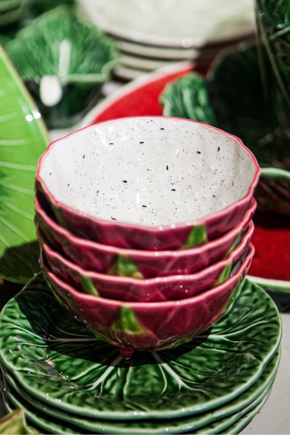 Showcase a beautiful fruit bowl as a centerpiece in your burgundy kitchen