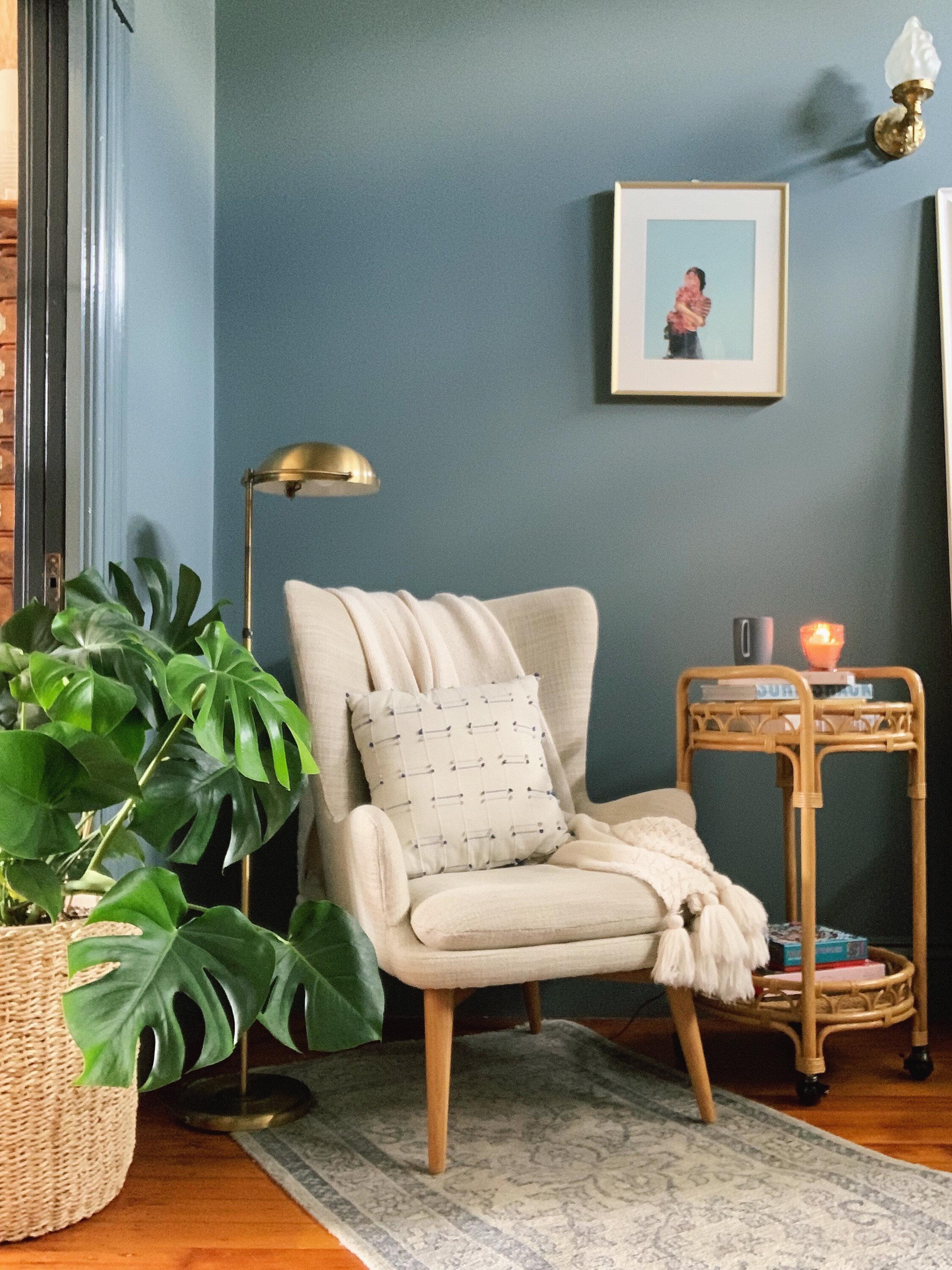 Designate a reading corner with a comfy chair and stylish bookshelf