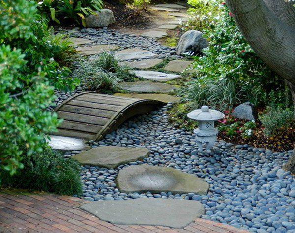 Install a small bridge over pebbled ‌paths as a charming ‍addition to ‍your Zen Garden