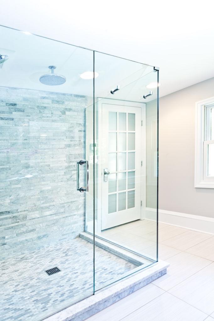 Choose clear or frosted glass for shower enclosures in narrow bathrooms