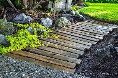 Pallet Garden‍ Pathway: Design an attractive pathway lined with pallets for a rustic garden feel