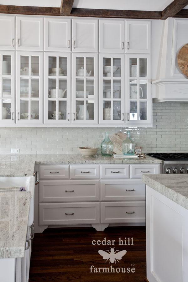 Farmhouse-style cabinets with glass​ doors showcase cherished ‍dishware in your farmhouse kitchen