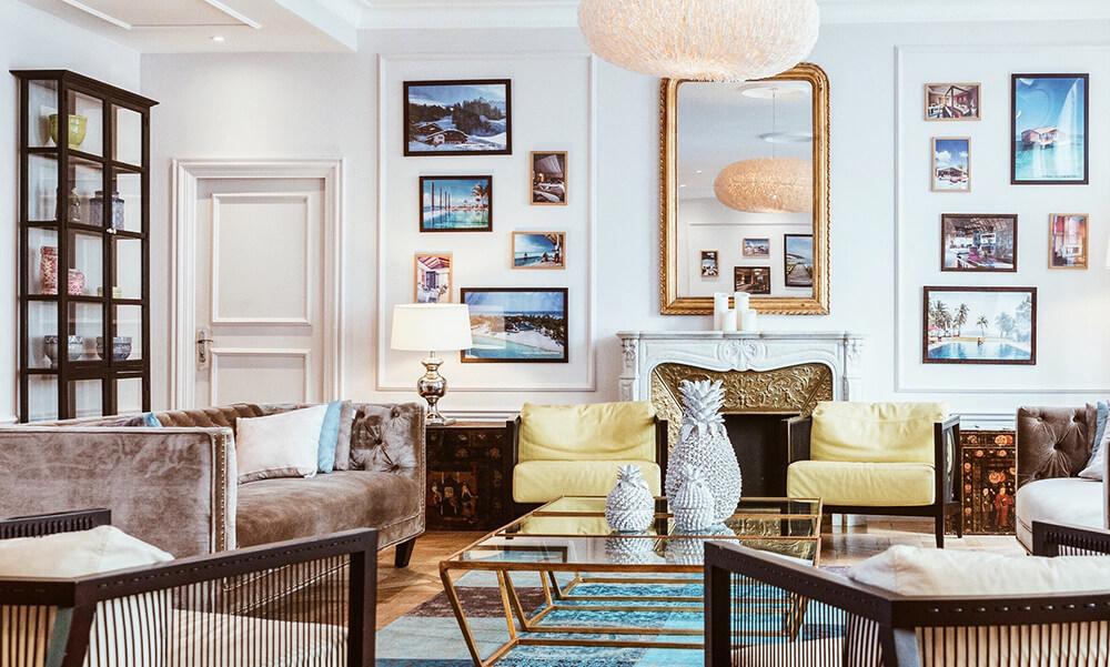 Use mirrors to reflect light and ​expand space in your eclectic living room